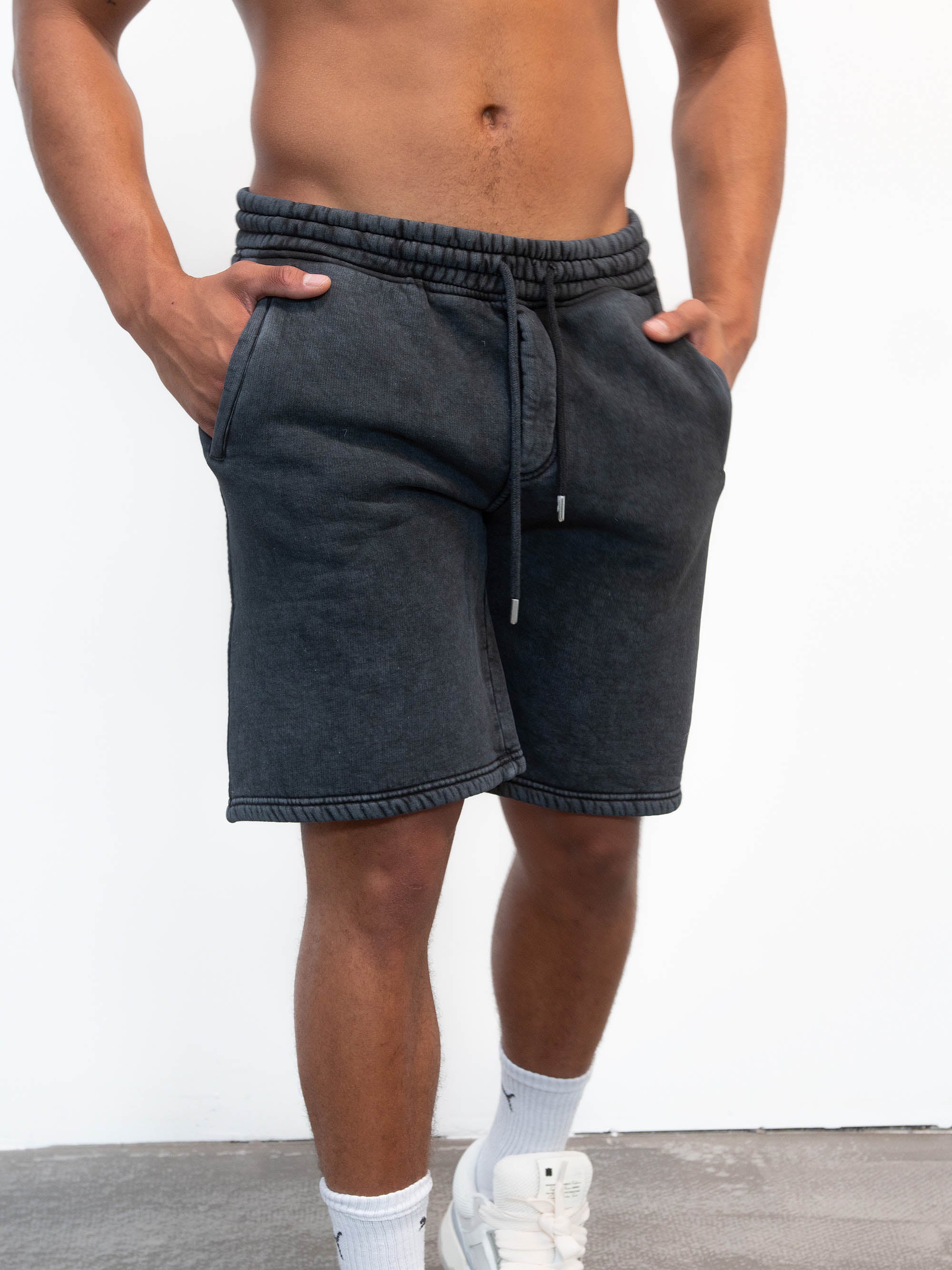 Model wearing a washed black shorts blank
