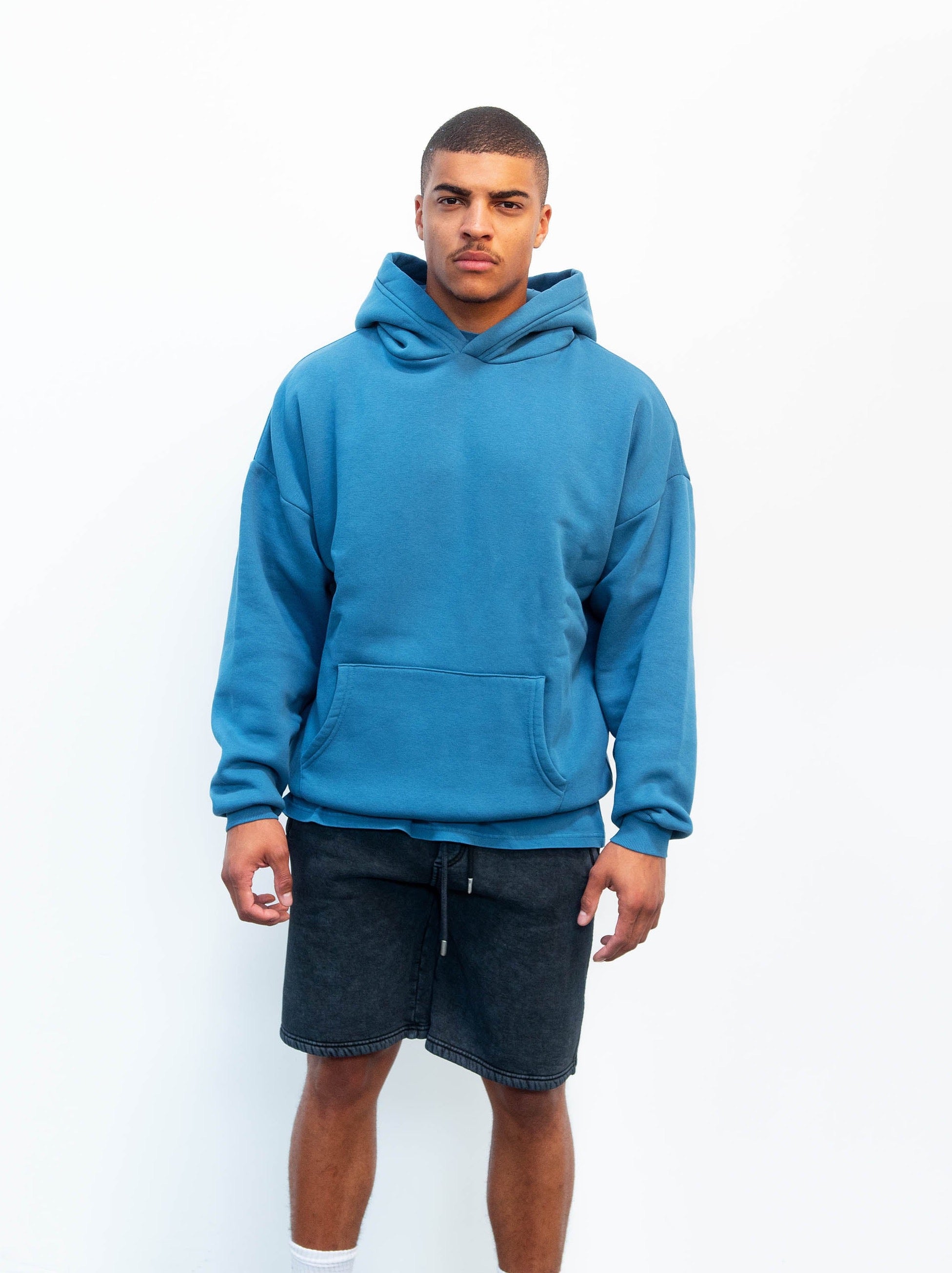 Model wearing midnight blue hoodie - oversized fit