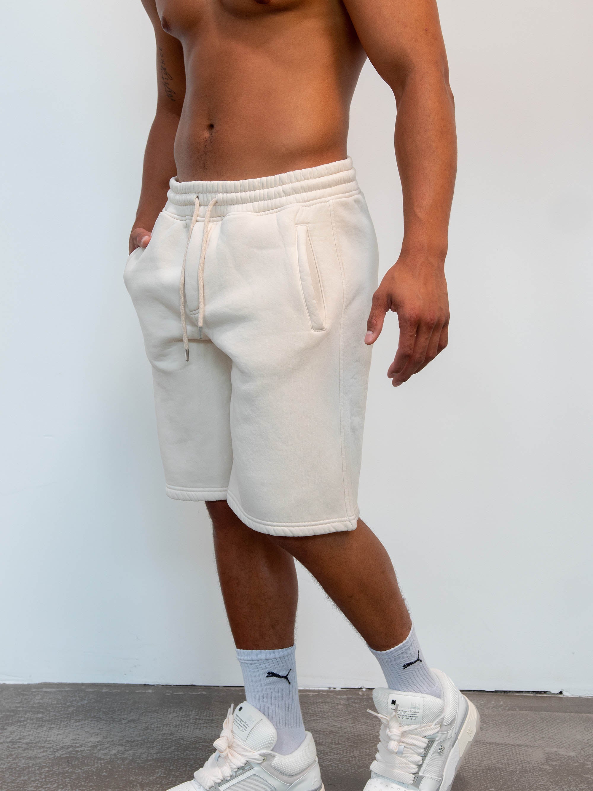 Model wearing short in color creme