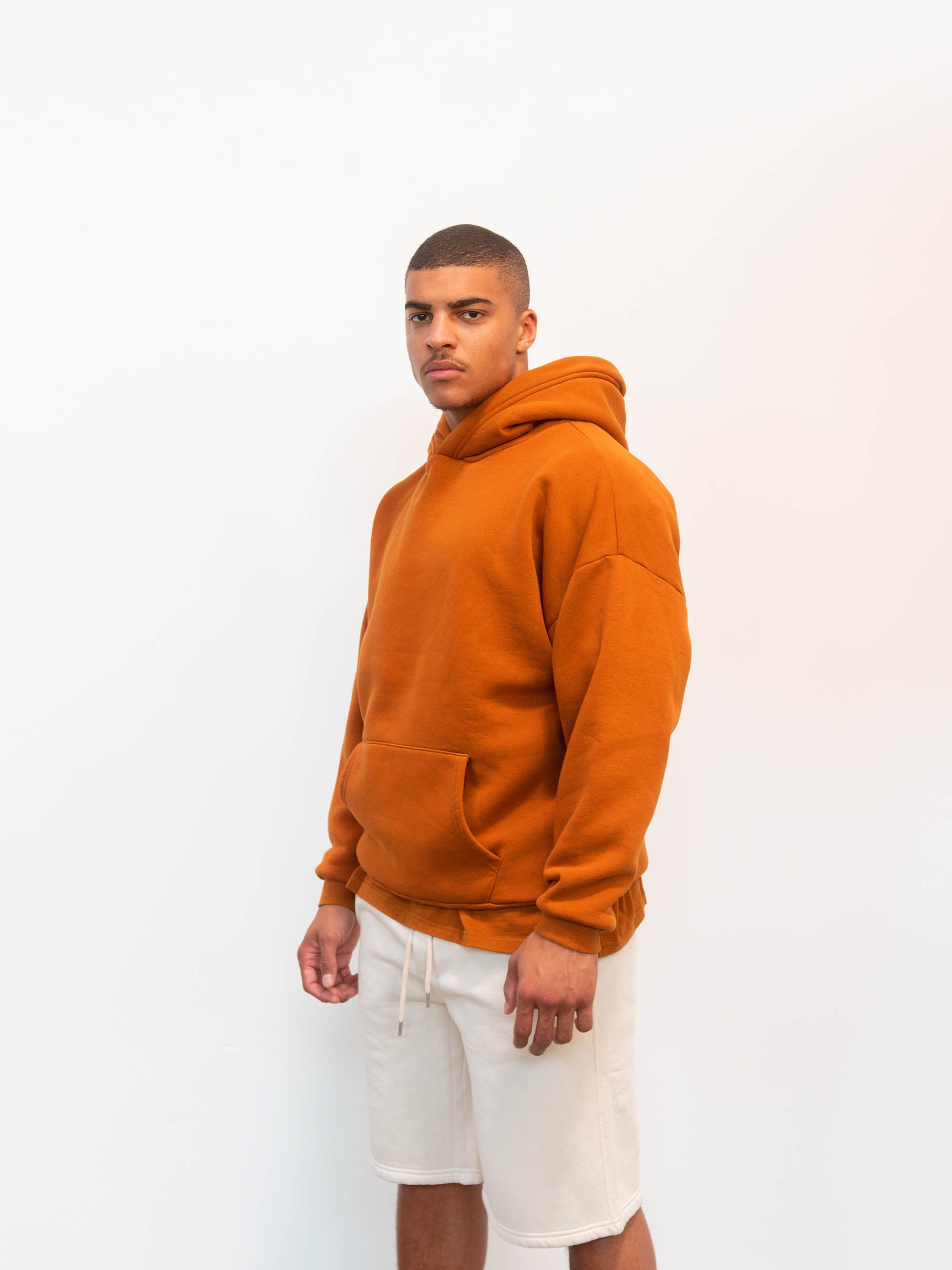 Model wearing caramel hoodie Blank