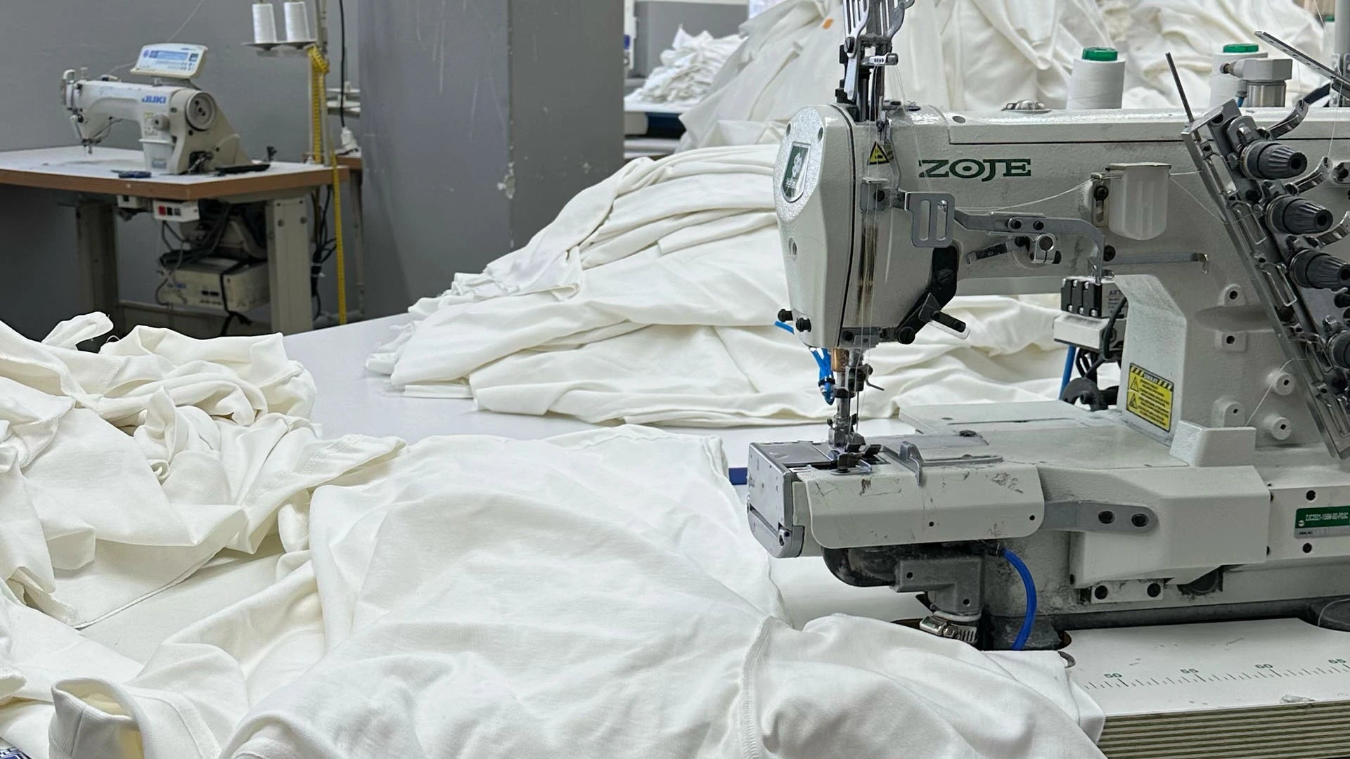 Sewing patterns of white tshirts in Istanbul factory