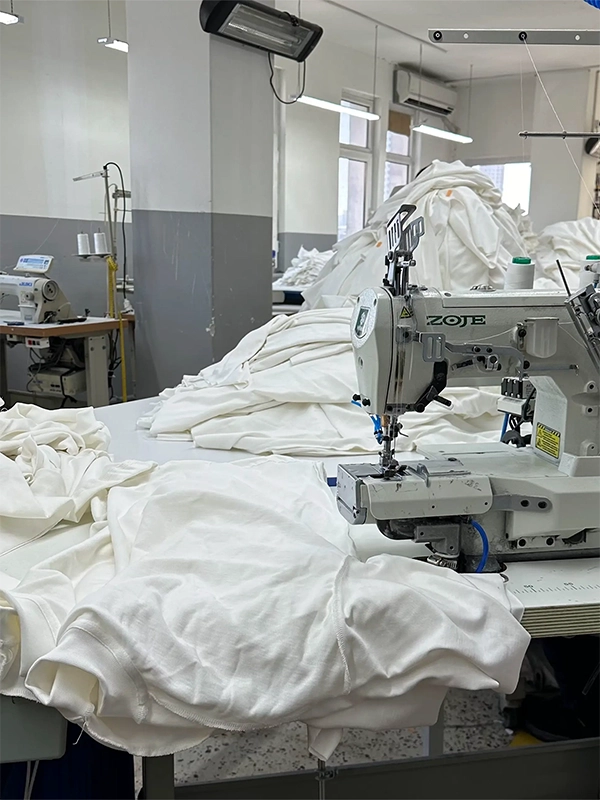 Sewing patterns of white tshirts in Istanbul factory