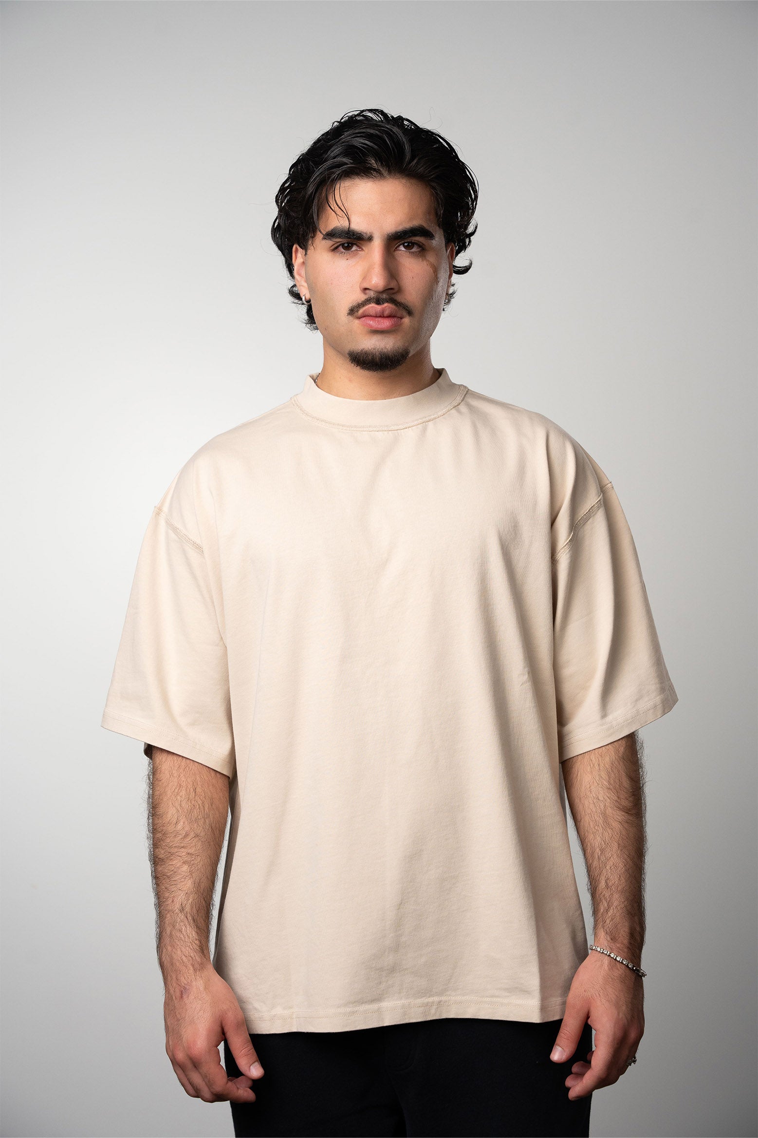 Model wearing the LEMUTA Blank tee in the color stone
