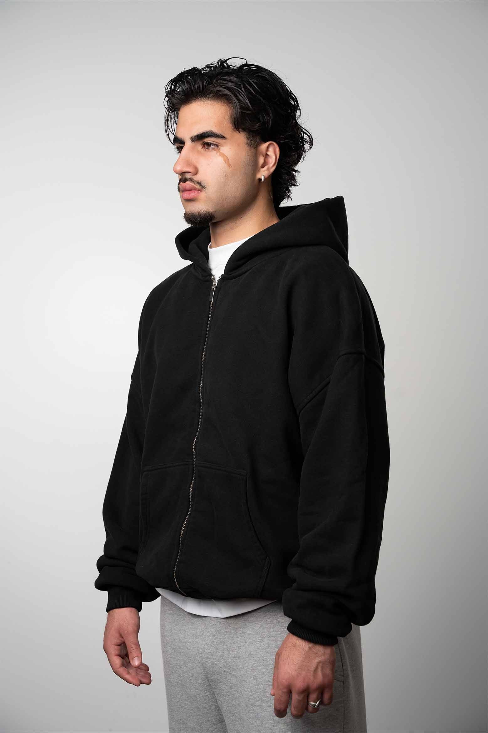 A model is wearing a LEMUTA Blank zipper - perfect for custom prints & embroidery