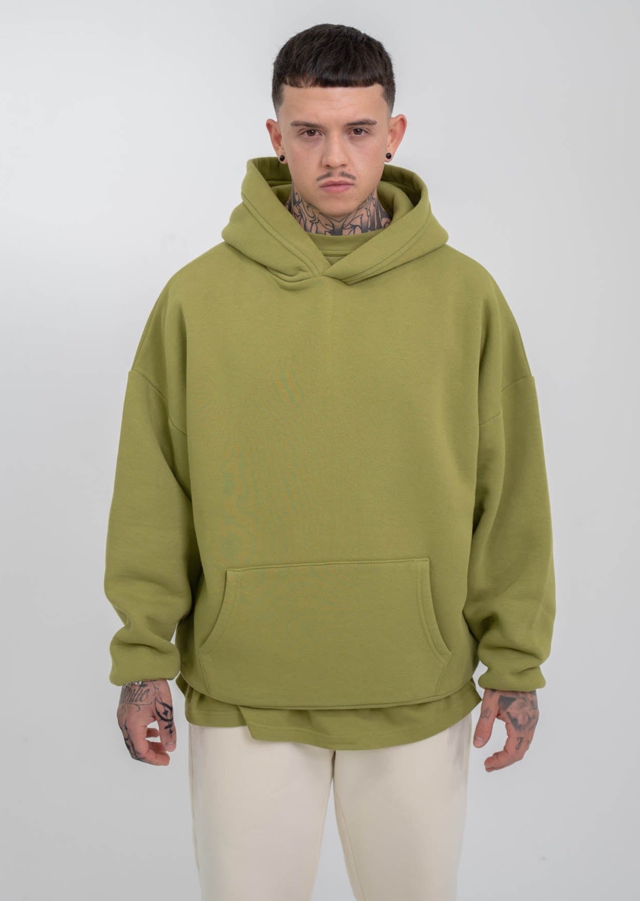 Model wearing green hoodie Blank
